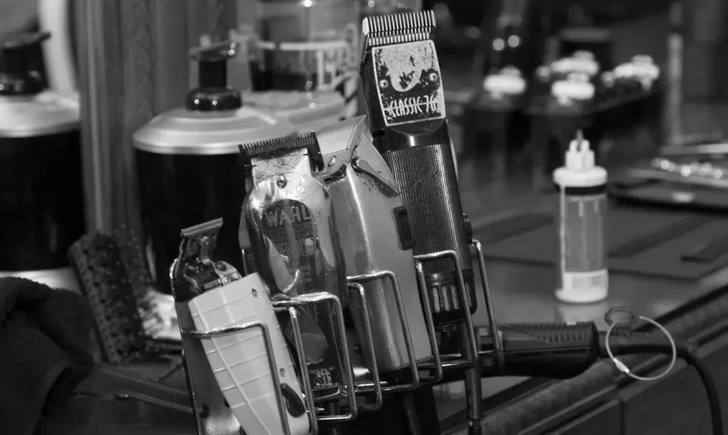 Vintage clippers and tools at a Clever Barber station