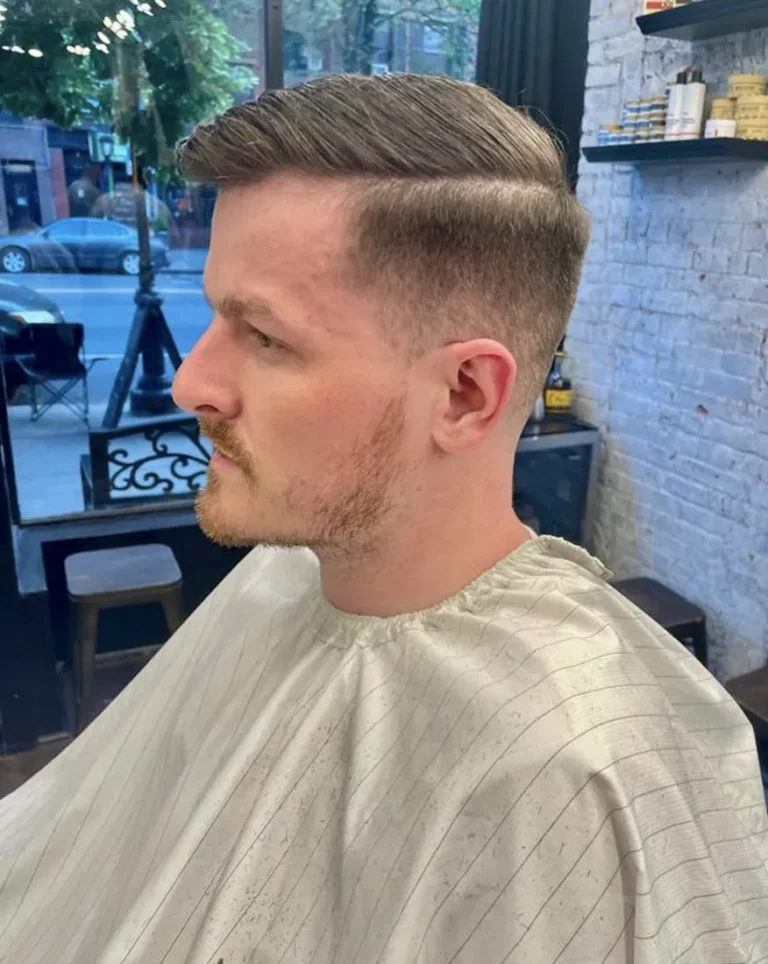 Classic side part with tapered sides and beard